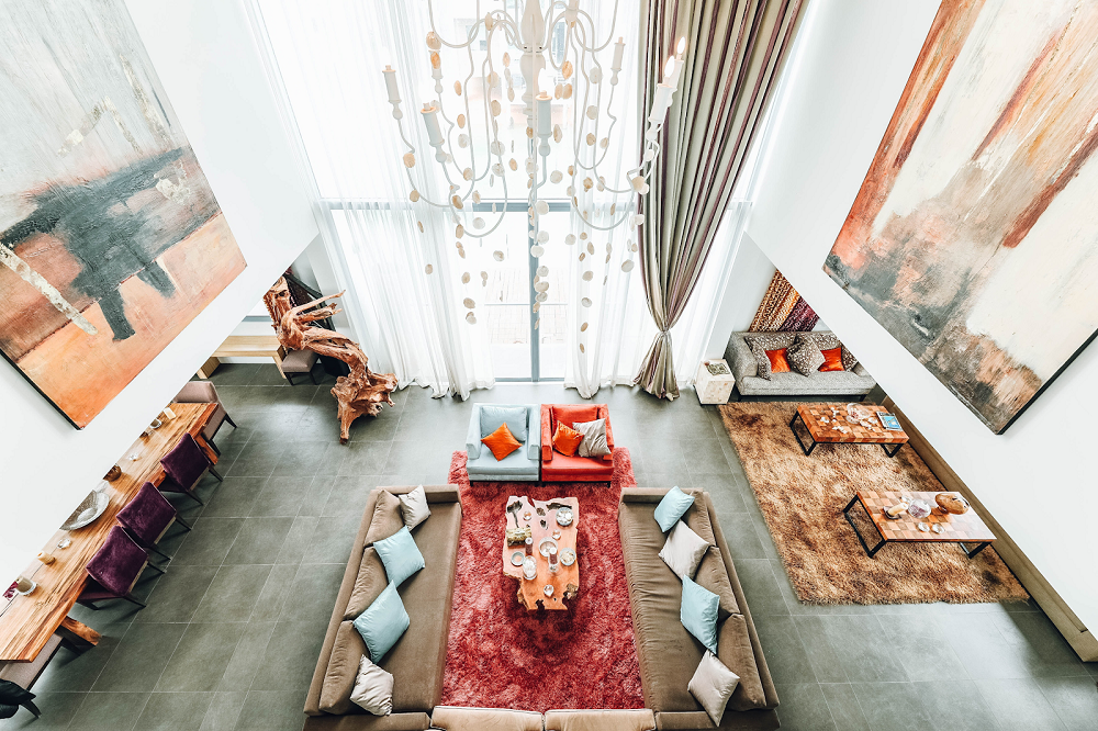 a luxury living room with tall windows